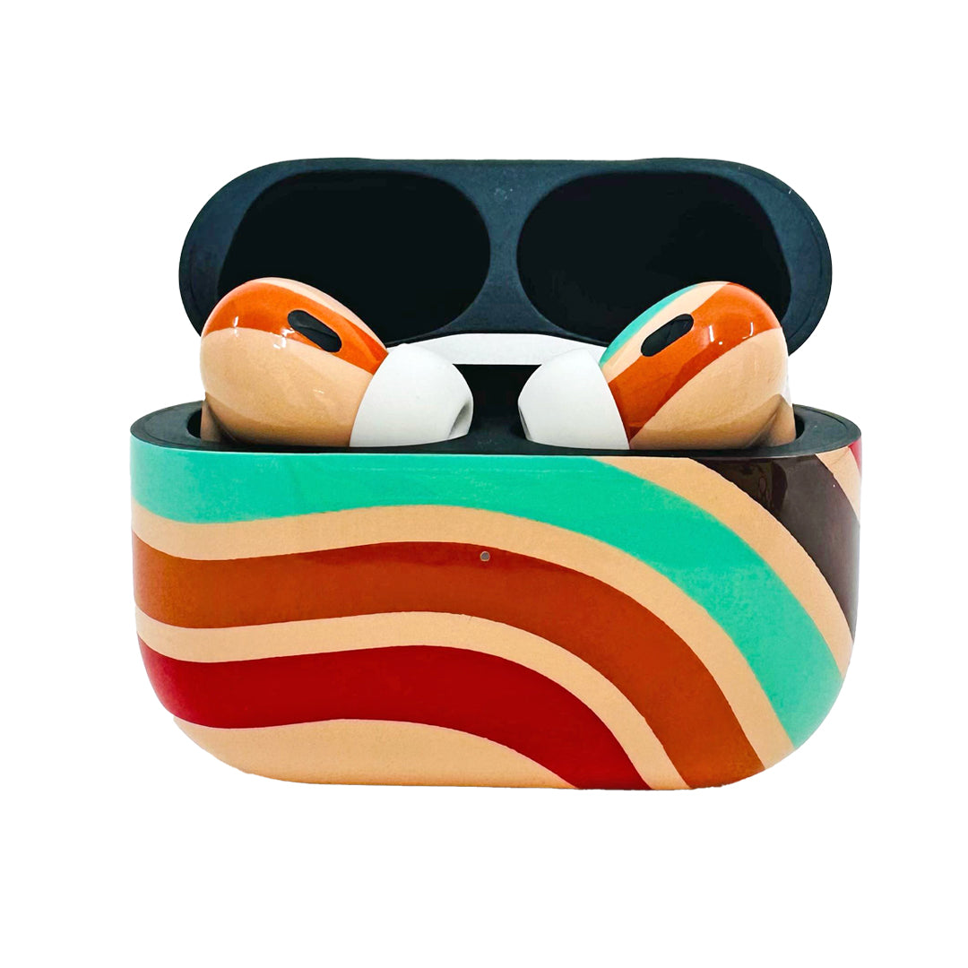 Colorful wireless earbuds in a case on a white background