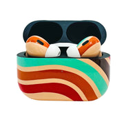 Colorful wireless earbuds in a case on a white background